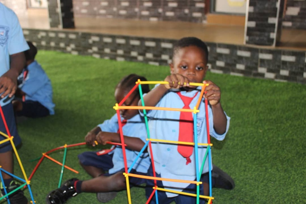 Students playing football at Spring Of Life Schools